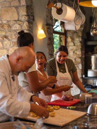 Tuscookany Tuscany cooking classes Franco teaching at Torre del Tartufo